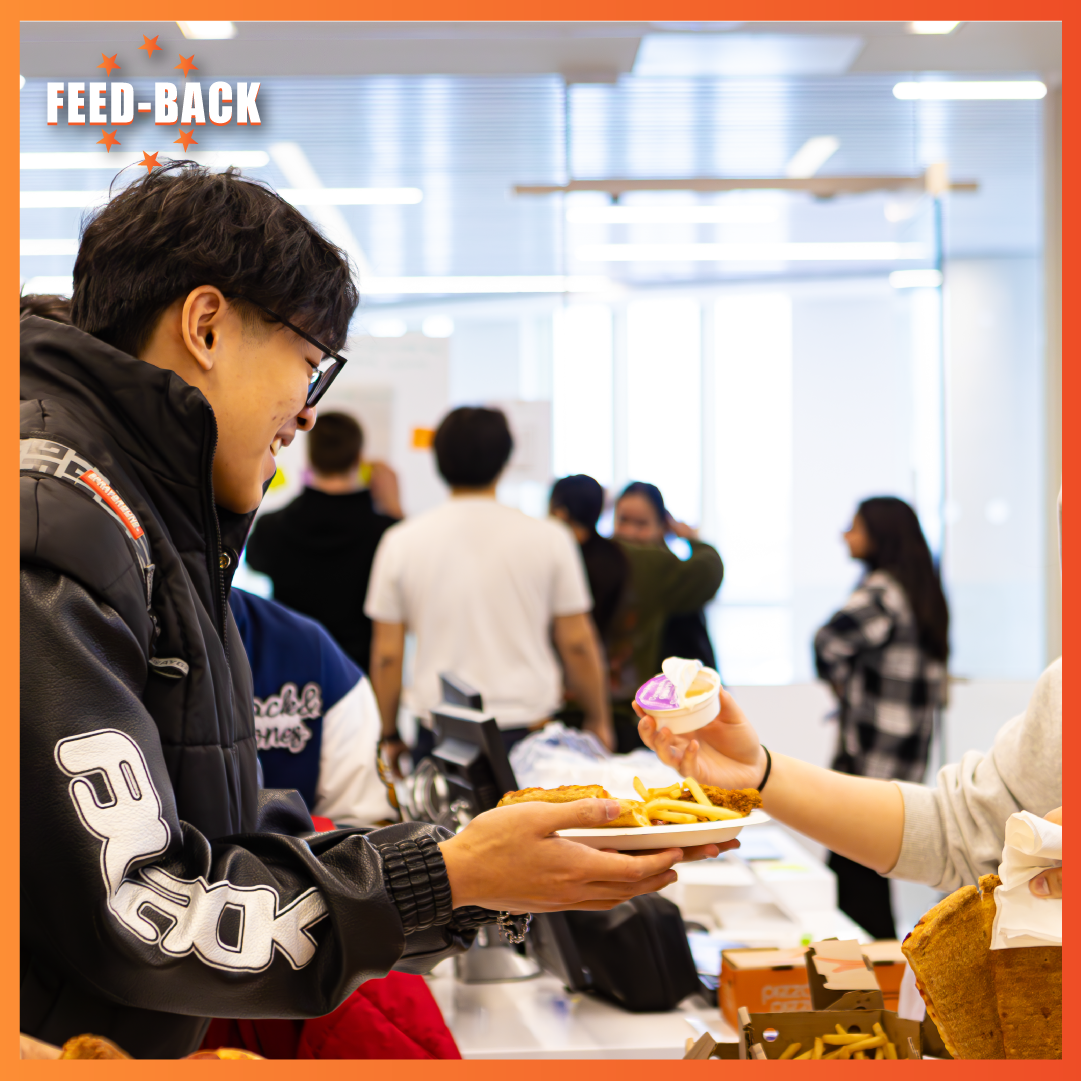 People getting food at the Feedback Event